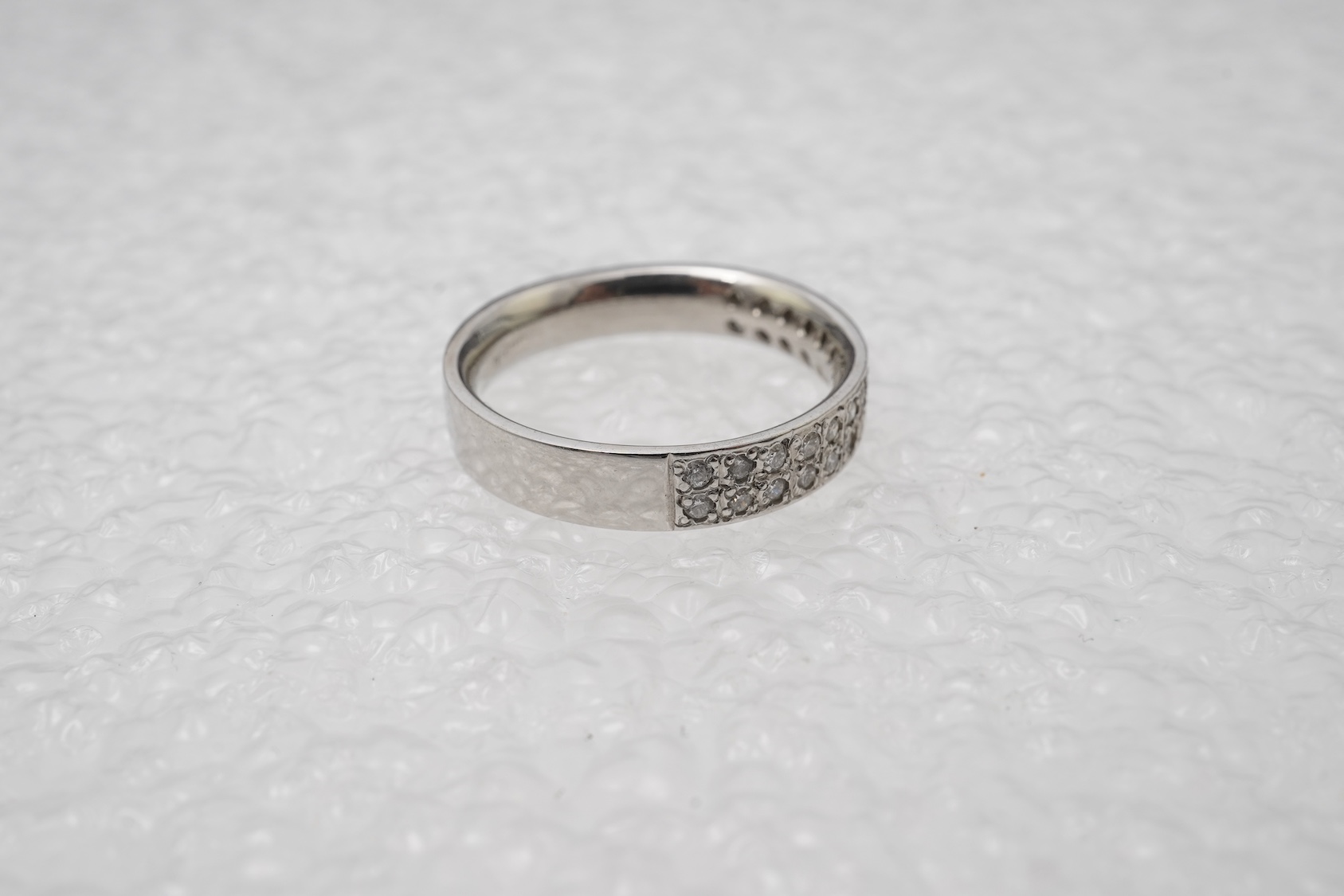 A diamond half eternity ring